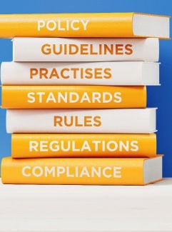 A stack of books - policies, guidelines, practises, standards, rules, regulations, compliance